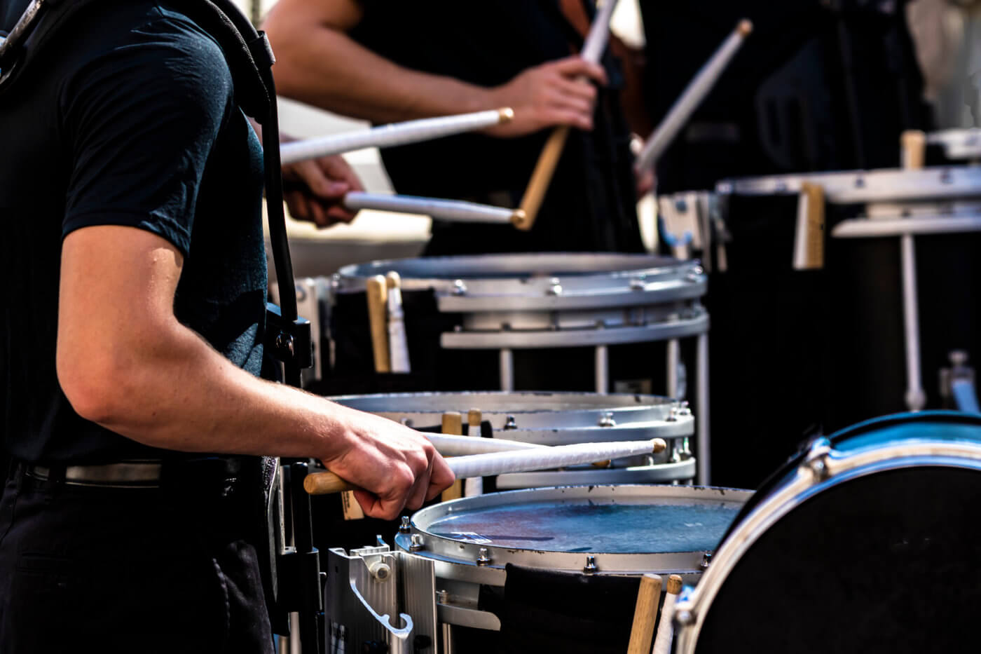 Portion of a marching band drum line performing